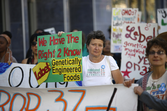 A demonstrator holds a sign during a rally in support of the state's upcoming Proposition 37 ballot measure in San Francisco, California October 6, 2012. (Reuters / Stephen Lam)